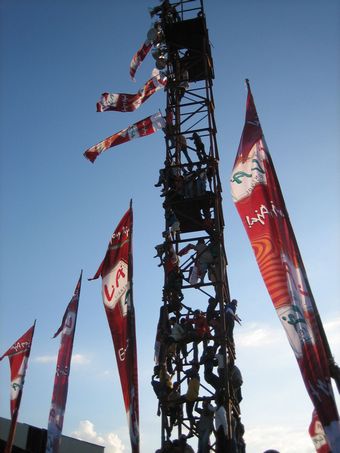 People climb high to watch Peter Pan perform at a concert in Dili sloman2.jpg